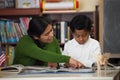 Hispanic Mom and Boy in Home-school Setting Studying Rocks Royalty Free Stock Photo