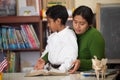 Hispanic Mom and Boy in Home-school Setting During Worship Royalty Free Stock Photo