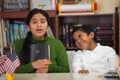 Hispanic Mom and Boy in Home-school Setting During Worship Royalty Free Stock Photo