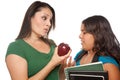 Hispanic Mother and Daughter with Books & Apple Royalty Free Stock Photo