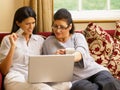 Hispanic mother and daughter shopping online Royalty Free Stock Photo