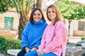 Hispanic mother and daughter smiling happy looking at the camera at the park Royalty Free Stock Photo