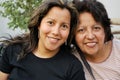 Hispanic mother and grown daughter