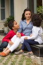 Hispanic mother talking with her childeren. Royalty Free Stock Photo