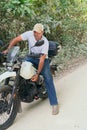 Hispanic motorcyclist who starts his journey after resting Royalty Free Stock Photo