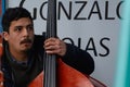 Hispanic musician playing the double bass