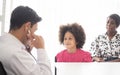 Hispanic physician meeting and diagnosis mixed-race afro children with her African American mother at a hospital. The doctor Royalty Free Stock Photo