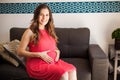 Hispanic pregnant woman at home Royalty Free Stock Photo