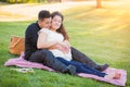 Sweet Hispanic Pregnant Young Couple Portrait Outdoors Royalty Free Stock Photo