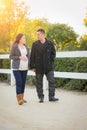 Hispanic Pregnant Young Couple Walking Outdoors Royalty Free Stock Photo