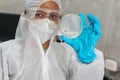 Hispanic scientist holding a petri dish in the science lab. Portrait of health care and the medical concept Royalty Free Stock Photo