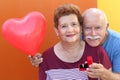 Hispanic senior couple celebrating 50th anniversary