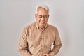 Hispanic senior man wearing glasses with hand on stomach because nausea, painful disease feeling unwell Royalty Free Stock Photo