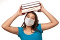 Hispanic Student Girl Wearing Face Mask with Books Isolated on White Royalty Free Stock Photo