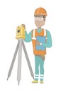 Hispanic surveyor builder working with theodolite.