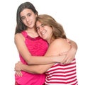 Hispanic teen girl hugging her mother and smiling Royalty Free Stock Photo