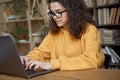 Hispanic teen girl school student using laptop elearning online. Royalty Free Stock Photo