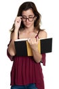 Hispanic teenage girl with glasses reading a book - On a white background Royalty Free Stock Photo