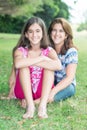 Hispanic teenage girl and her mother at a beautiful park Royalty Free Stock Photo