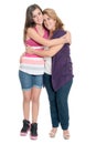 Hispanic teenage girl hugging her mother isolated on white