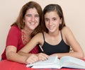 Hispanic teenage girl studying with her mother Royalty Free Stock Photo