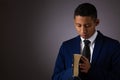 Hispanic Teenager Boy Seeking to Commune with God Via Prayer and Holding the Holy Bible