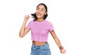 Hispanic teenager girl with dental braces wearing casual clothes dancing happy and cheerful, smiling moving casual and confident Royalty Free Stock Photo