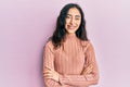 Hispanic teenager girl with dental braces wearing casual clothes happy face smiling with crossed arms looking at the camera Royalty Free Stock Photo