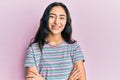 Hispanic teenager girl with dental braces wearing casual clothes happy face smiling with crossed arms looking at the camera Royalty Free Stock Photo