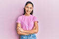 Hispanic teenager girl with dental braces wearing casual clothes happy face smiling with crossed arms looking at the camera Royalty Free Stock Photo