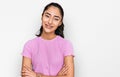 Hispanic teenager girl with dental braces wearing casual clothes happy face smiling with crossed arms looking at the camera Royalty Free Stock Photo