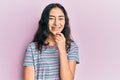 Hispanic teenager girl with dental braces wearing casual clothes looking confident at the camera with smile with crossed arms and Royalty Free Stock Photo