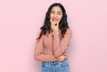 Hispanic teenager girl with dental braces wearing casual clothes looking confident at the camera smiling with crossed arms and Royalty Free Stock Photo