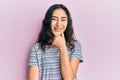 Hispanic teenager girl with dental braces wearing casual clothes looking confident at the camera smiling with crossed arms and Royalty Free Stock Photo