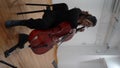 hispanic woman cellist performing a concert, latin female cello player, musician playing violoncello