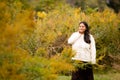 Hispanic Woman Enjoying the Colorful Wild Flowers at Forest Preserve