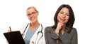 Hispanic Woman with Female Doctor or Nurse Royalty Free Stock Photo