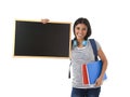 Hispanic woman or female student holding blank blackboard with copy space for adding message Royalty Free Stock Photo