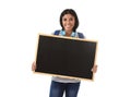 Hispanic woman or female student holding blank blackboard with copy space for adding message Royalty Free Stock Photo