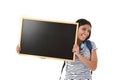 Hispanic woman or female student holding blank blackboard with copy space for adding message Royalty Free Stock Photo