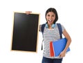 Hispanic woman or female student holding blank blackboard with copy space for adding message Royalty Free Stock Photo