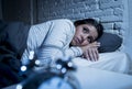 Hispanic woman at home bedroom lying in bed late at night trying to sleep suffering insomnia Royalty Free Stock Photo