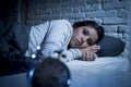 Hispanic woman at home bedroom lying in bed late at night trying to sleep suffering insomnia Royalty Free Stock Photo