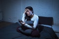 Hispanic woman at home bedroom lying in bed late at night trying to sleep suffering insomnia Royalty Free Stock Photo