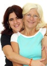 Hispanic woman hugging her mother isolated on whit
