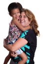 Hispanic woman hugging a mutiracial little girl Royalty Free Stock Photo