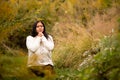 Woman Praying in Forest Preserve Alone on a Beautiful Autumn Day Royalty Free Stock Photo