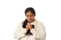 Hispanic Woman Praying While Holding Bible on White Background Royalty Free Stock Photo