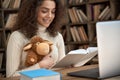 Hispanic woman remote teacher reading fairy tale book teaching children online. Royalty Free Stock Photo