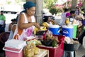Hispanic woman sells the prepared meal